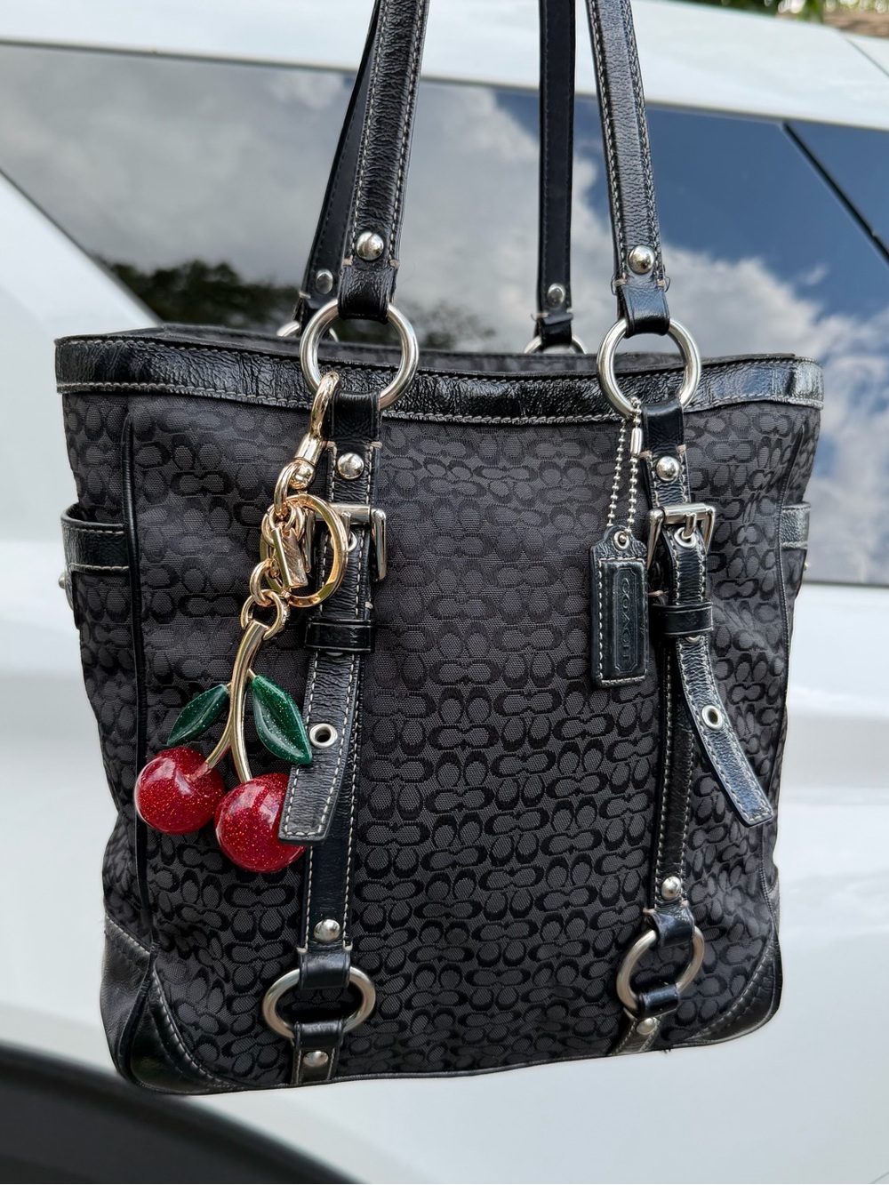 Coach Black Signature Canvas Shoulder Tote with Red Cherry Charm